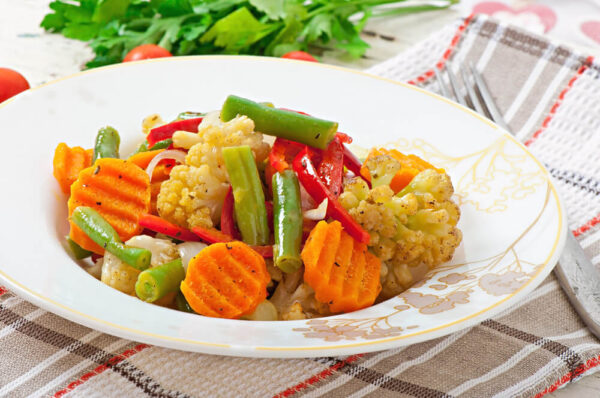 Vegetable medley on a decorative plate.