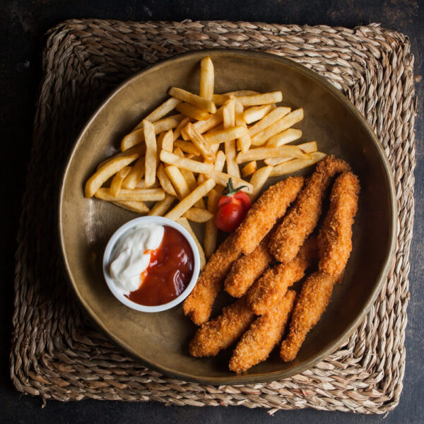 Chicken tenders with fries and dipping sauces.