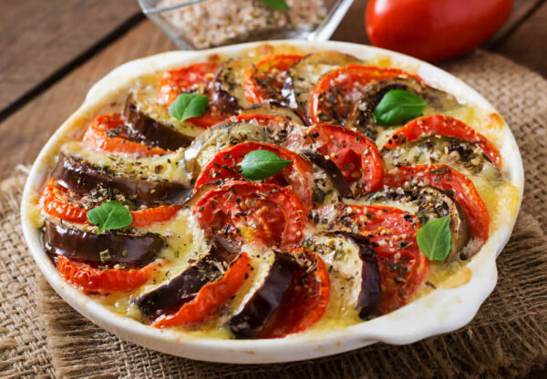 Baked vegetable dish with tomatoes and eggplant.