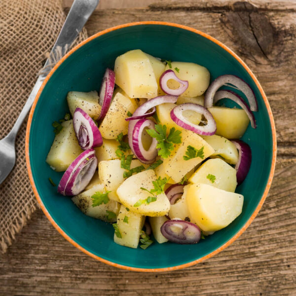 Potato salad with red onions and herbs.